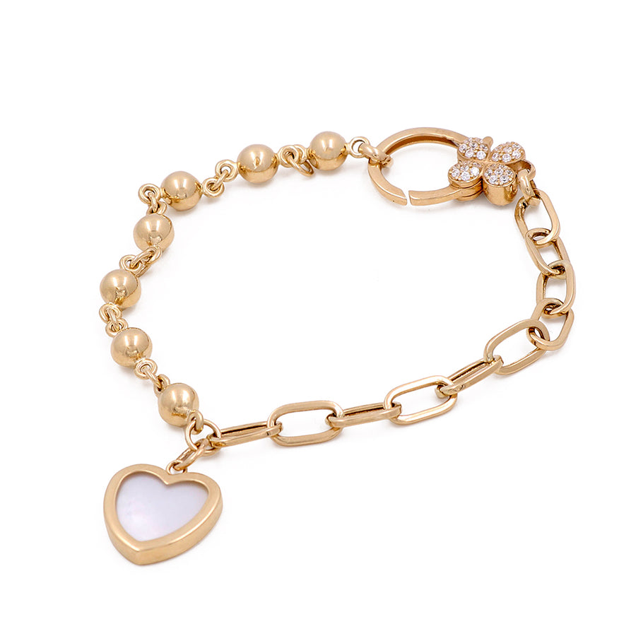 A Miral Jewelry 14K Yellow Gold Women's Bracelet with Heart Pendant in Mother of Pearl and Cubic Zirconias.