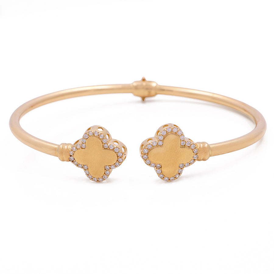 A 14K Yellow Gold Fashion Flower Bangle with Cubic Zirconias adorned with diamonds and cubic zirconias from Miral Jewelry.