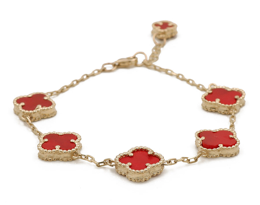A Miral Jewelry 14K Yellow Gold Fashion Flower Women's Red Stones Bracelet, perfect for adding a pop of color to your outfit.