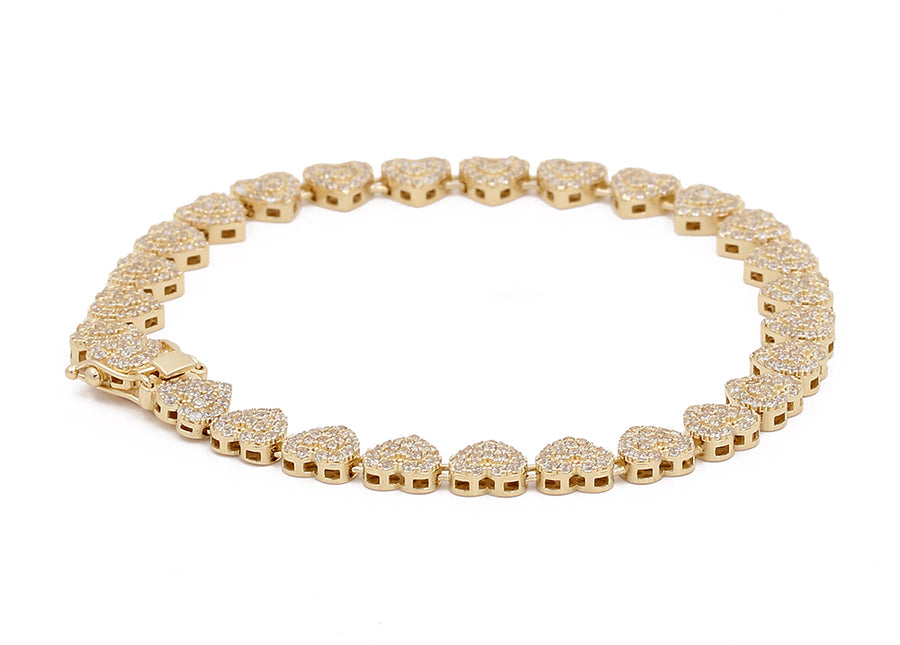 Miral Jewelry's 14K Yellow Gold Fashion Hearts Link Bracelet with Cubic Zirconias, isolated on a white background.