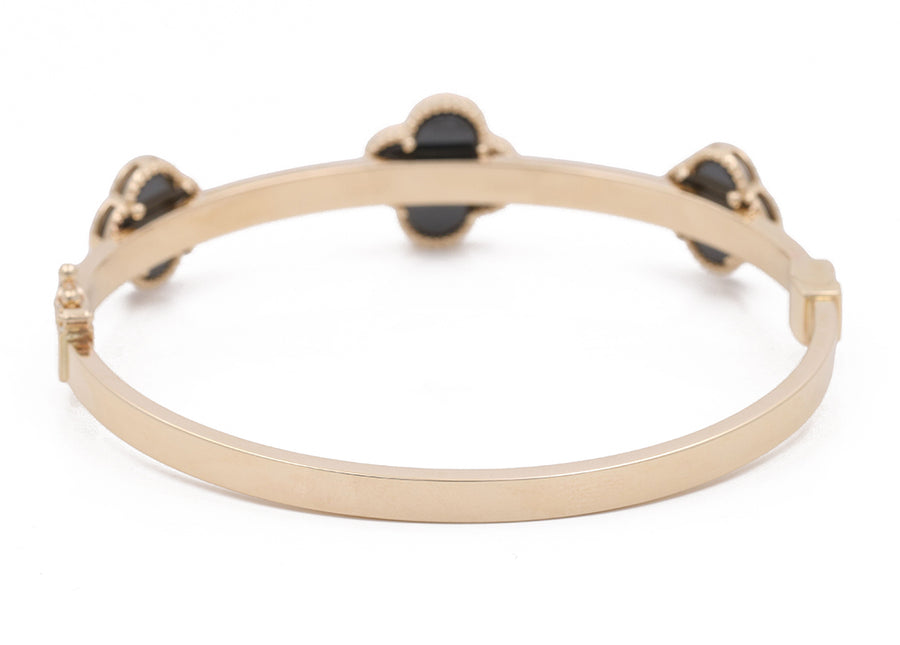 Miral Jewelry's 14K Yellow Gold Fashion with Onyx Flowers Bracelet features small diamonds on a white background.