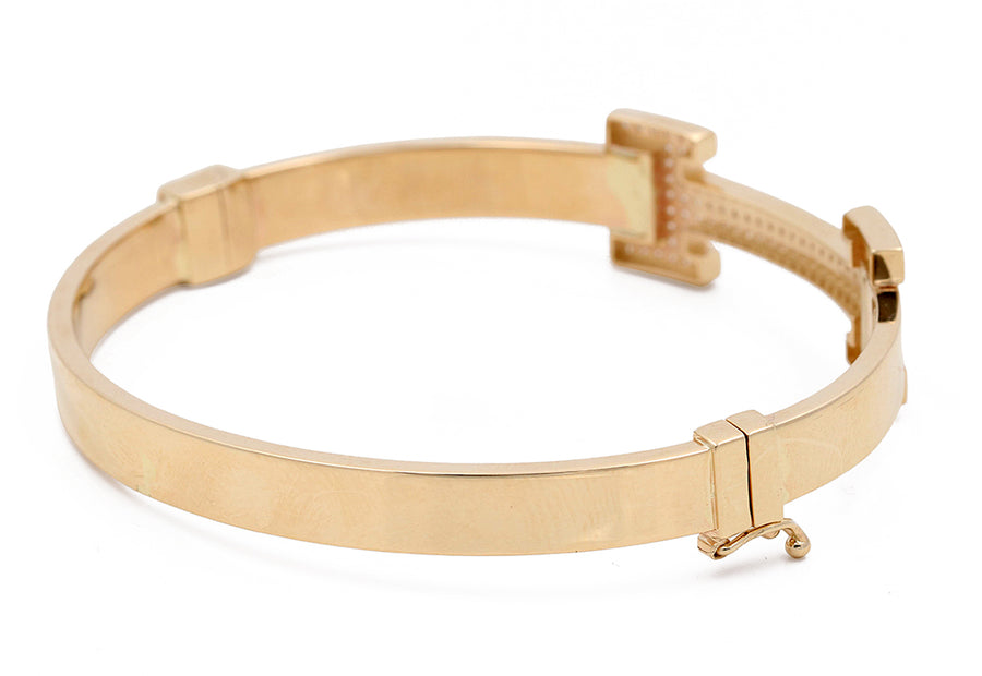 Gold-colored Miral Jewelry 14K yellow gold metal belt with a clasp lock mechanism, displayed against a white background.