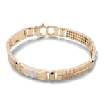 Gold 14K yellow gold bracelet with a series of rectangular links and a clasp closure, featuring a small silver accent in the center and a grid pattern on one section. This high-quality jewelry piece is crafted as an exquisite Miral Jewelry 14K Yellow and White Gold Fashion Italian Medusa Bracelet.