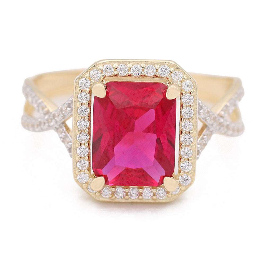 A Miral Jewelry fashion ring featuring a 14K yellow gold fashion ring with a pink center stone and cubic zirconias, crafted in 14K yellow gold.