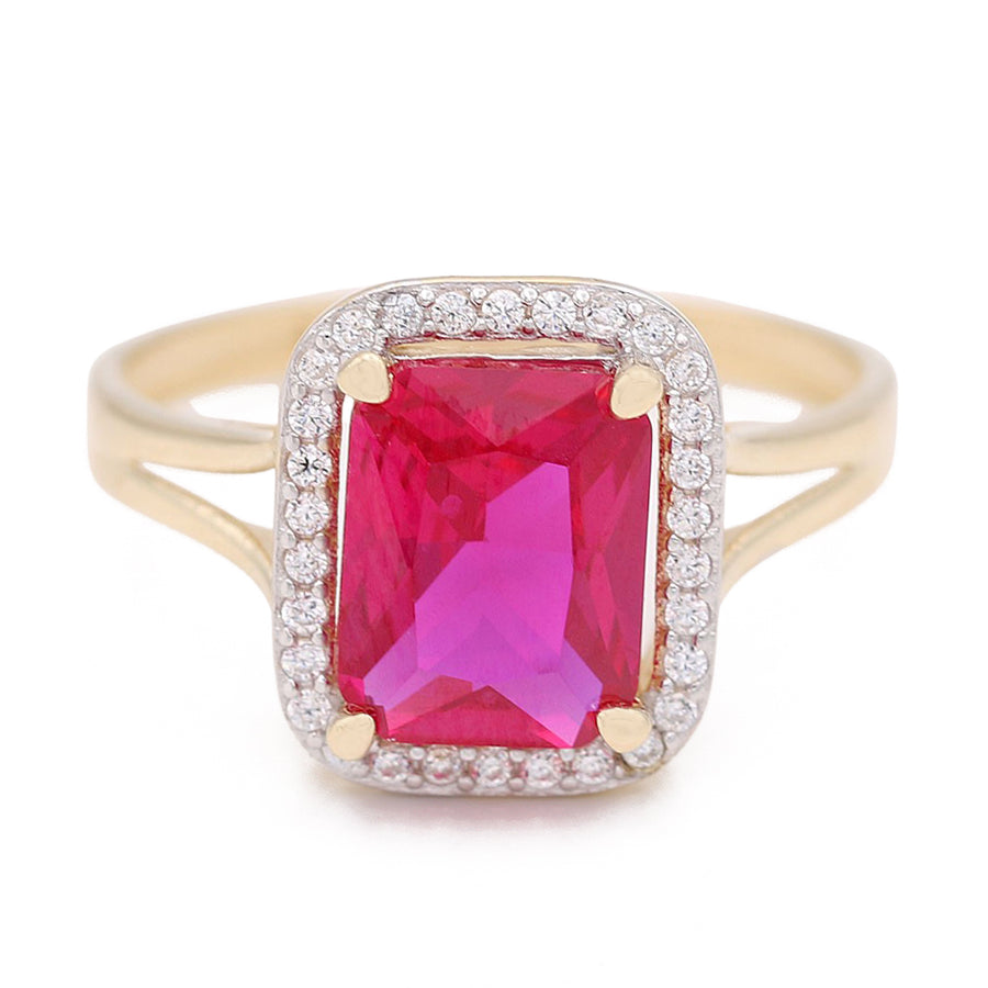 A Miral Jewelry fashion ring with a pink sapphire and diamonds, boasting 14K yellow gold.