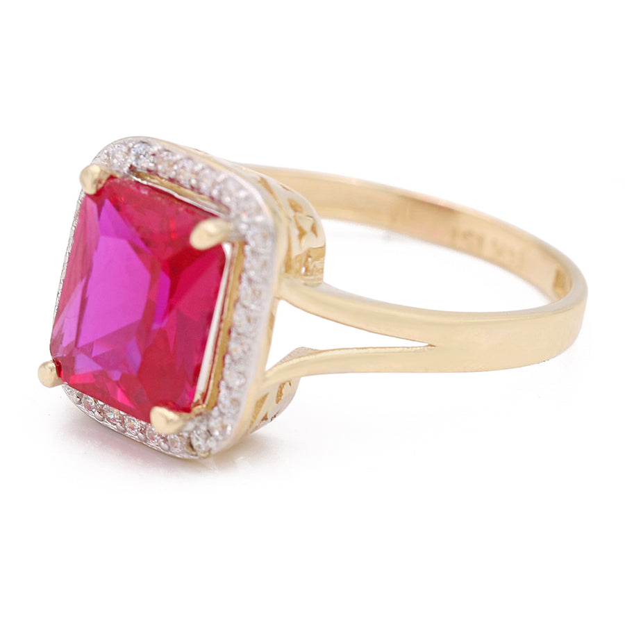 A Miral Jewelry 14K Yellow Gold Fashion Ring with Pink Square Center Stone and Cubic Zirconias.