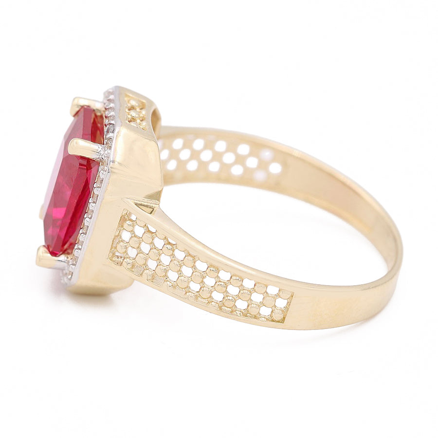 A Miral Jewelry 14K Yellow Gold Fashion Ring with Pink Center Stone and Cubic Zirconias.