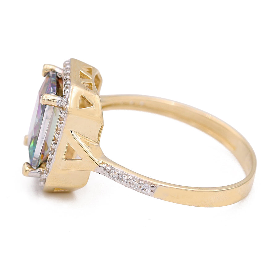 A yellow gold ring with a topaz and diamonds featuring a Miral Jewelry 14K Yellow Gold Fashion Ring with Color Center Stone and Cubic Zirconias.