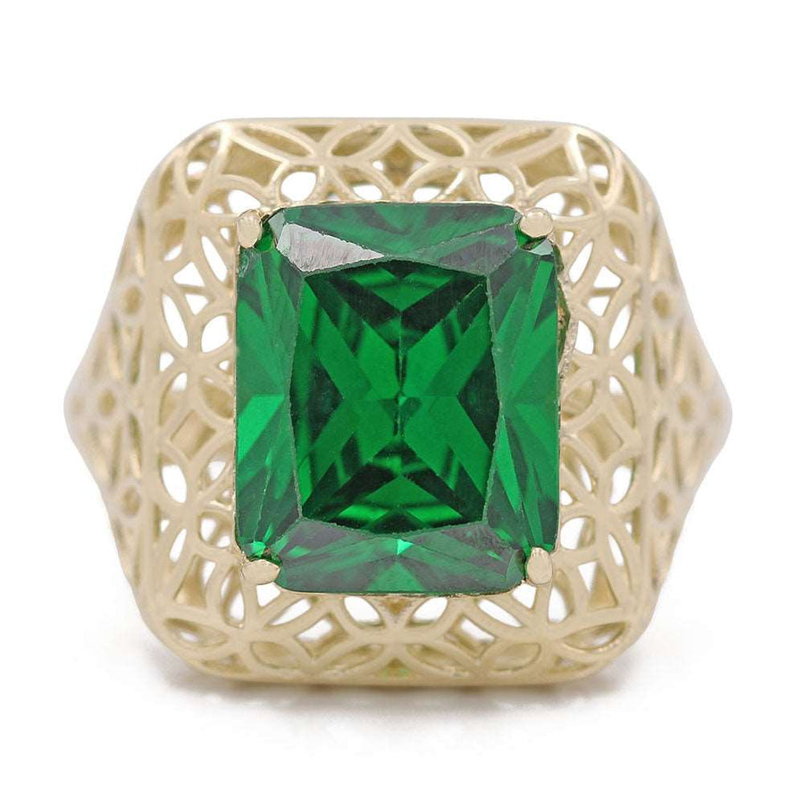 A 14K Yellow Gold Fashion Ring with Green Center Stone and Cubic Zirconias in an emerald cut by Miral Jewelry.