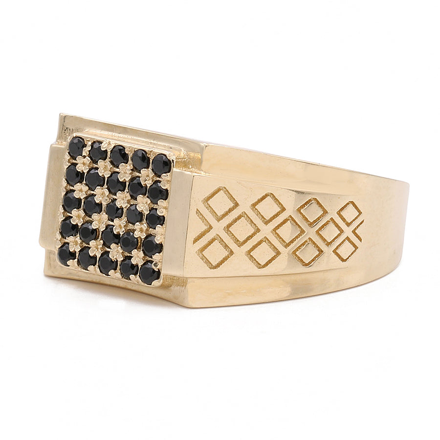 A Miral Jewelry 14K Yellow Gold Fashion Ring adorned with black diamonds, making it a fashionable statement piece.