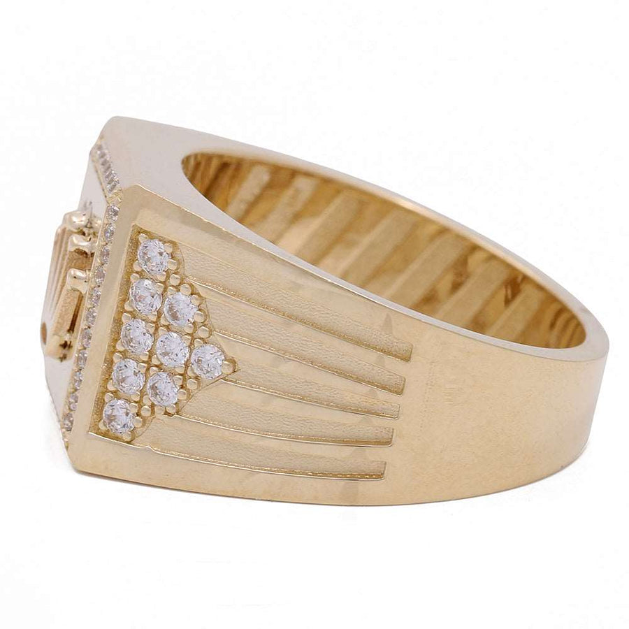 A Miral Jewelry 14K Yellow Gold Fashion Men's Ring with Cubic Zirconias in the center.