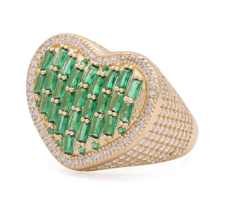 A stunning Miral Jewelry fashion ring featuring a heart-shaped emerald and diamond set in the 14K Yellow Gold Fashion Ring with Color Stones and Cubic Zirconias.