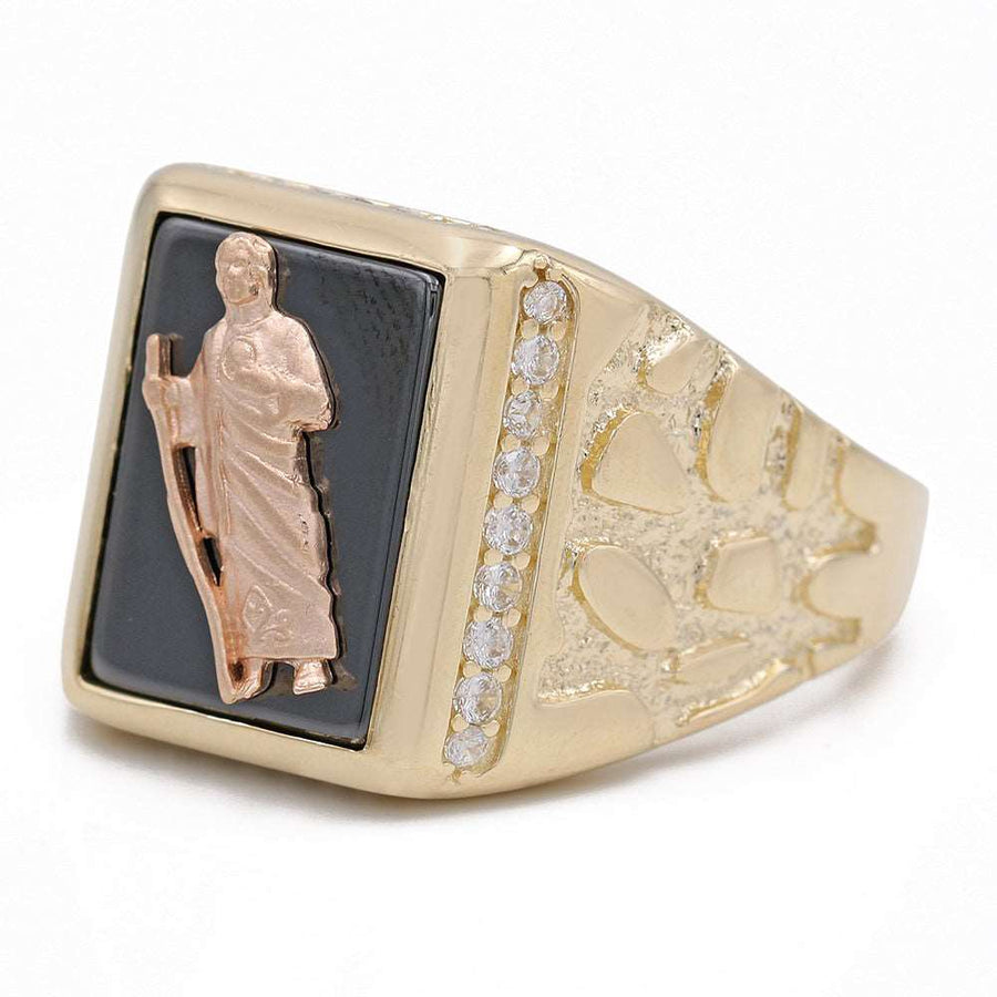A Miral Jewelry 14K Yellow Gold Christ Design on Black Stone Ring with Cubic Zirconias, featuring a Christ design.