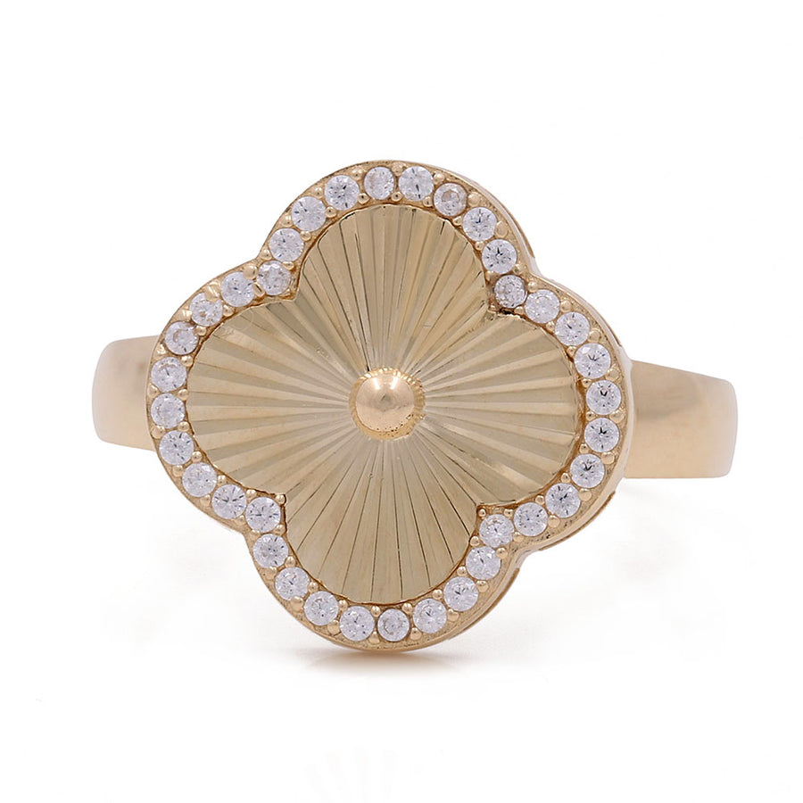 A stylish 14K yellow gold Miral Jewelry Diamond Cut Flower Fashion Ring with a floral design, accentuated by sparkling diamonds in the center.
