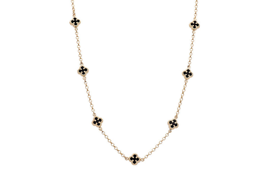 A fashionable necklace with black diamonds on a Miral Jewelry 14K Yellow Gold chain.