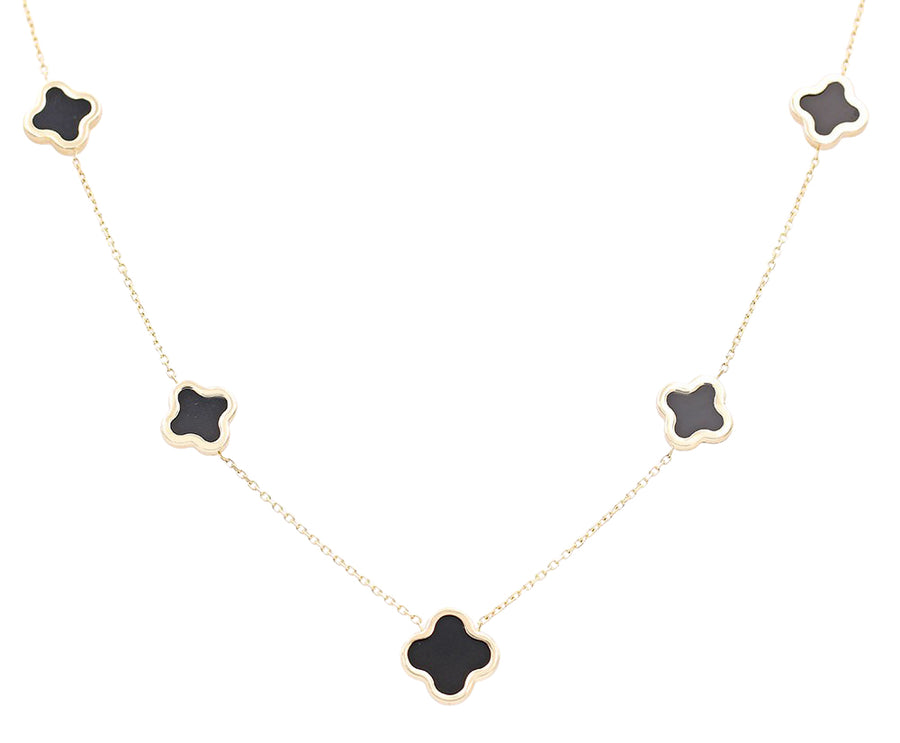 A Flowers Black Color Stone Necklace with four black clover pendants on a 14K yellow gold chain by Miral Jewelry.