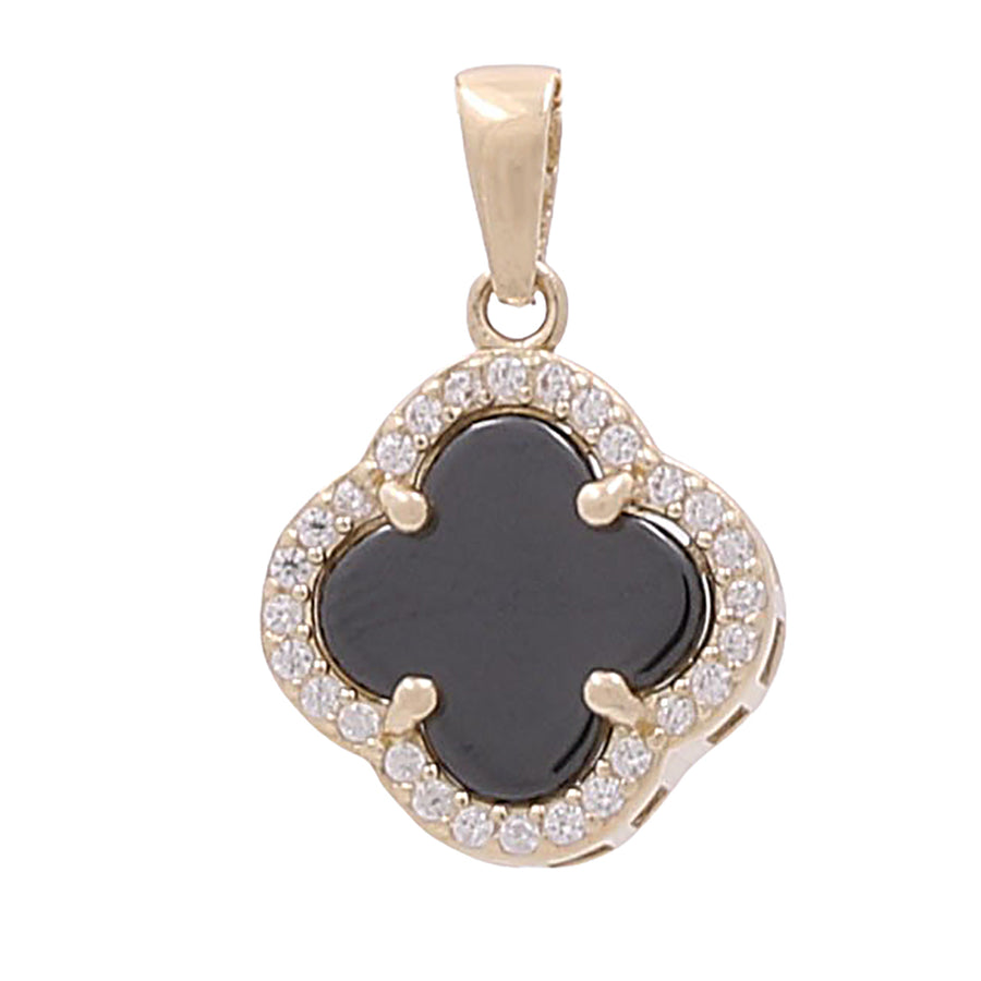A Miral Jewelry 14K Yellow Gold Fashion Flower Pendant with Black Onyx and Cubic Zirconias.
