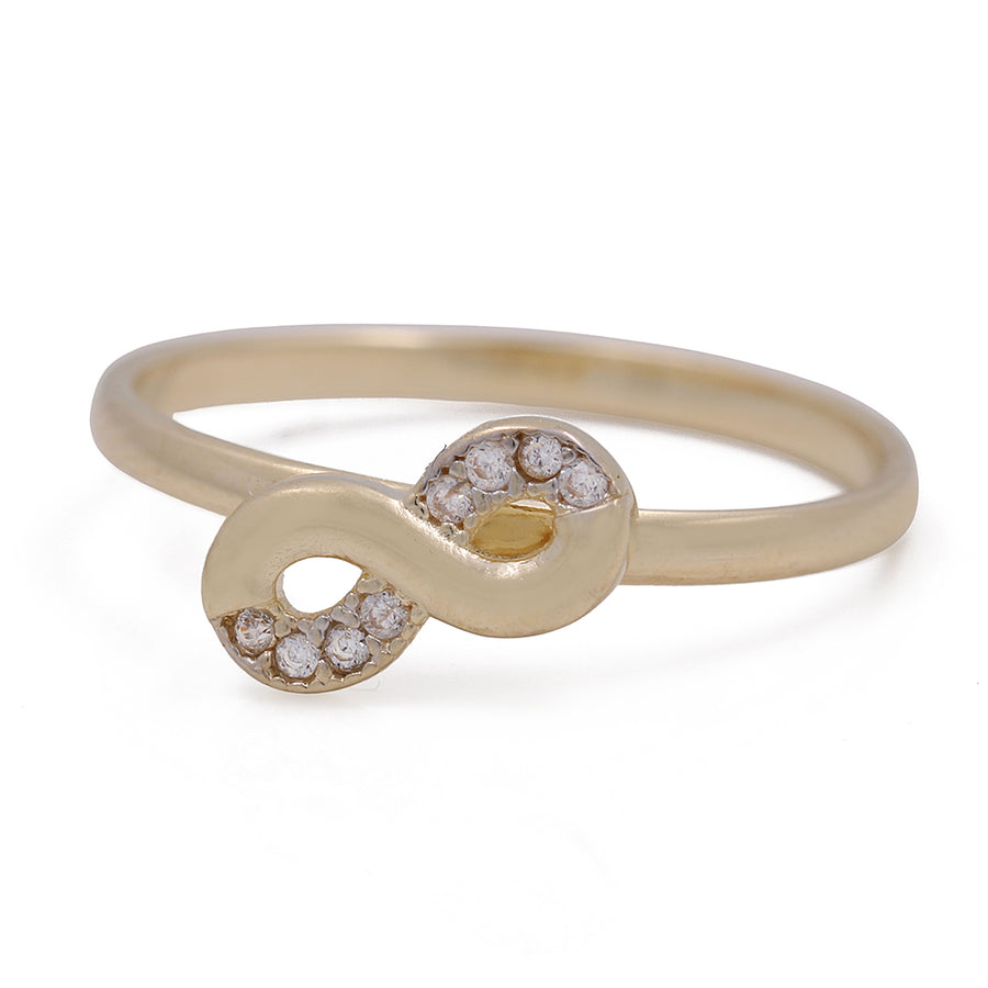A Miral Jewelry 14K Yellow Gold Fashion Infinity Ring with Cubic Zirconias, crafted in 14K yellow gold.