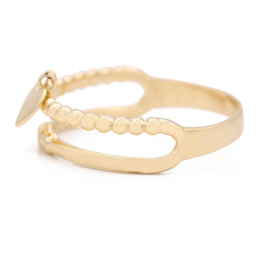 A Miral Jewelry 14K Yellow Gold Fashion Double Loop Ring with Heart Bead.