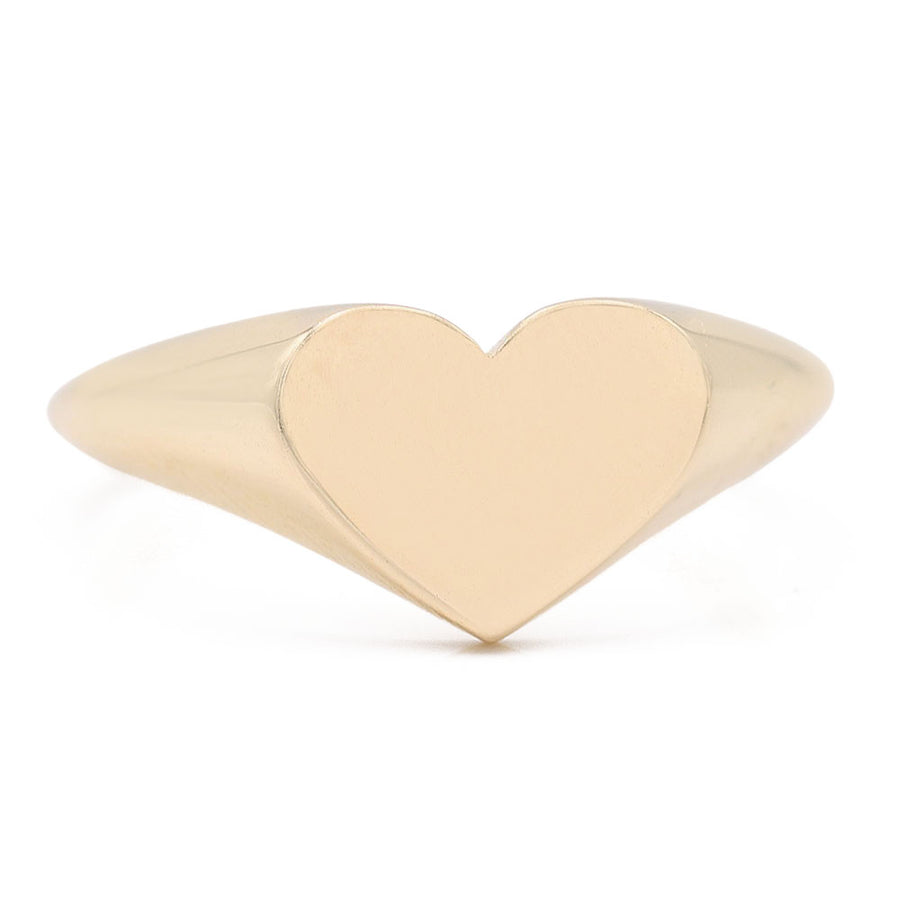 A fashionable 14K Yellow Gold Fashion Heart Shape Ring by Miral Jewelry on a white background.