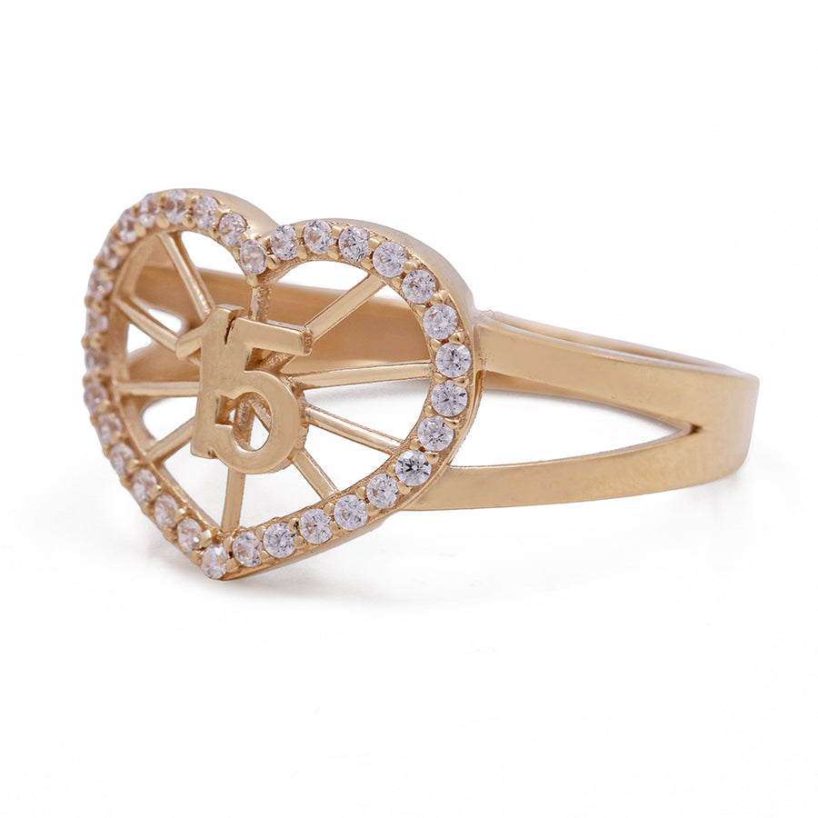 A 14K Yellow Gold 15 Heart Ring with Cubic Zirconias from Miral Jewelry.