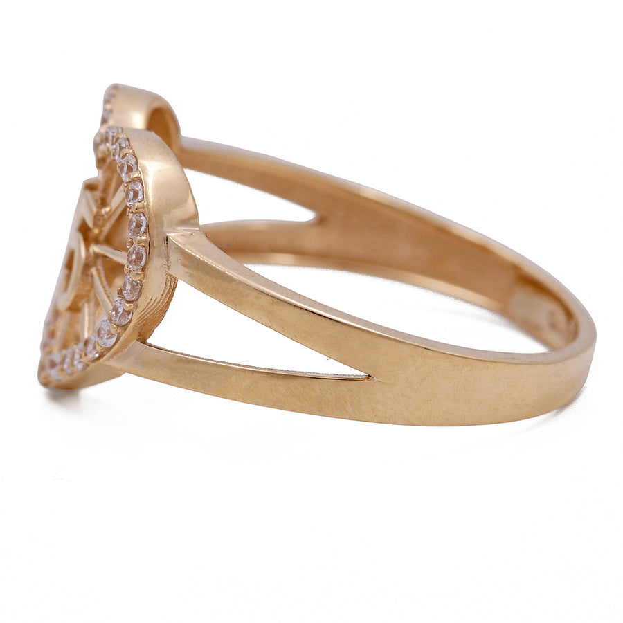 A 14K Yellow Gold 15 Heart Ring with Cubic Zirconias by Miral Jewelry, made of 14K Yellow Gold.