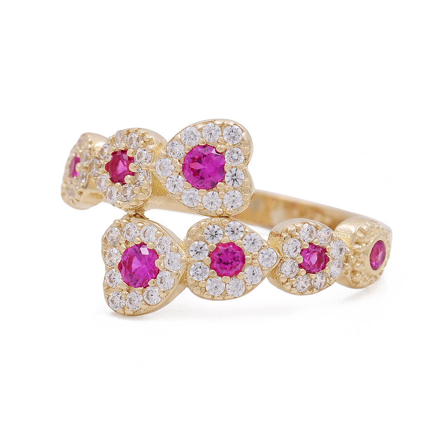 A 14K Yellow Gold Fashion Ring with Color Stones and Cubic Zirconias from Miral Jewelry, embellished with pink sapphires and diamonds.