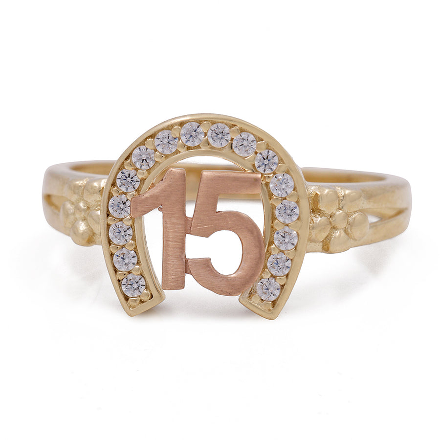 A 14K Yellow and Rose Gold 15 Horseshoe Ring with Cubic Zirconias by Miral Jewelry.