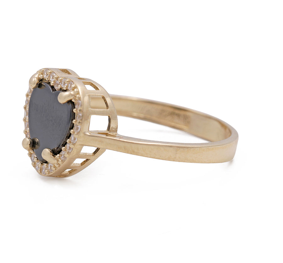 A trendy Miral Jewelry fashion ring featuring a stunning combination of 14K Yellow Gold and onyx, adorned with sparkling cubic zirconias.