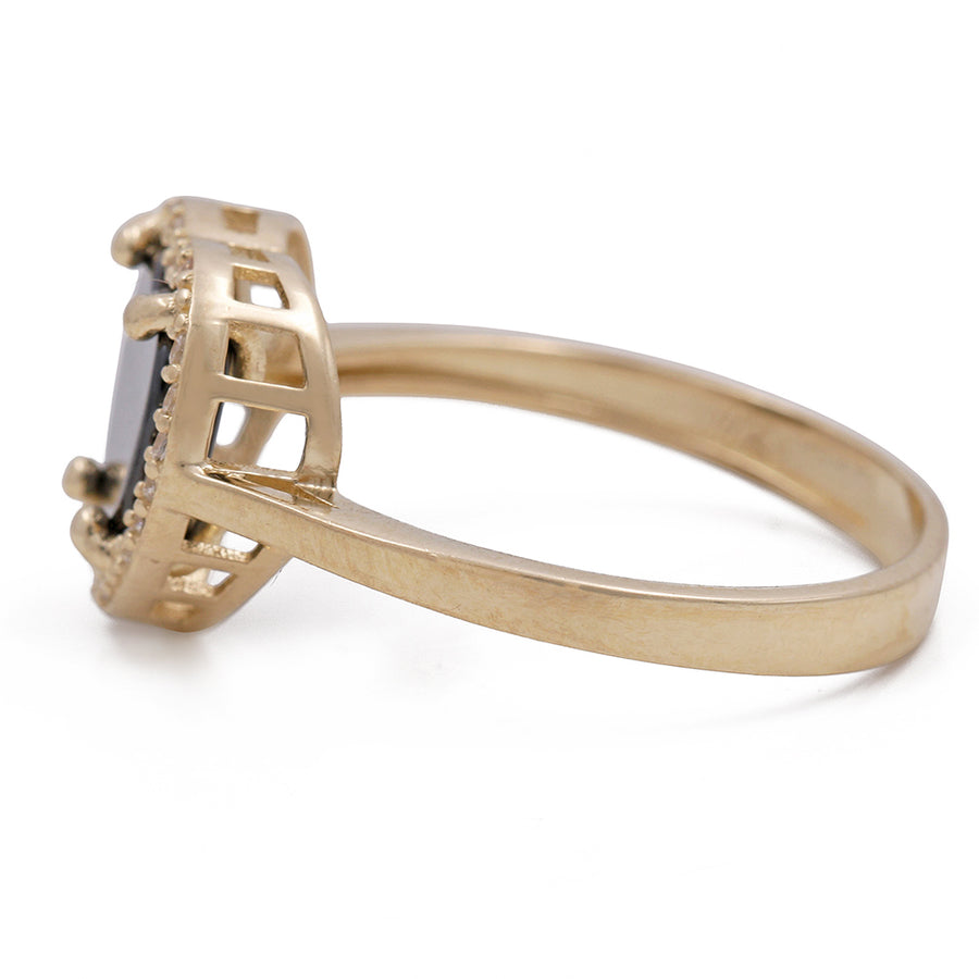 A Miral Jewelry 14K Yellow Gold Fashion Ring with Onyx Heart Center Stone and Cubic Zirconias.