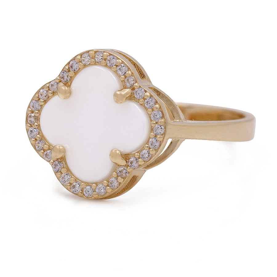 A Miral Jewelry fashion ring with a white and gold clover design, accented with diamonds is called 14K Yellow Gold Fashion Ring with Mother of Pearl and Cubic Zirconias.