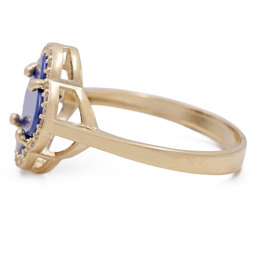 A Miral Jewelry fashion ring featuring a 14K yellow gold band and a vibrant blue sapphire stone.