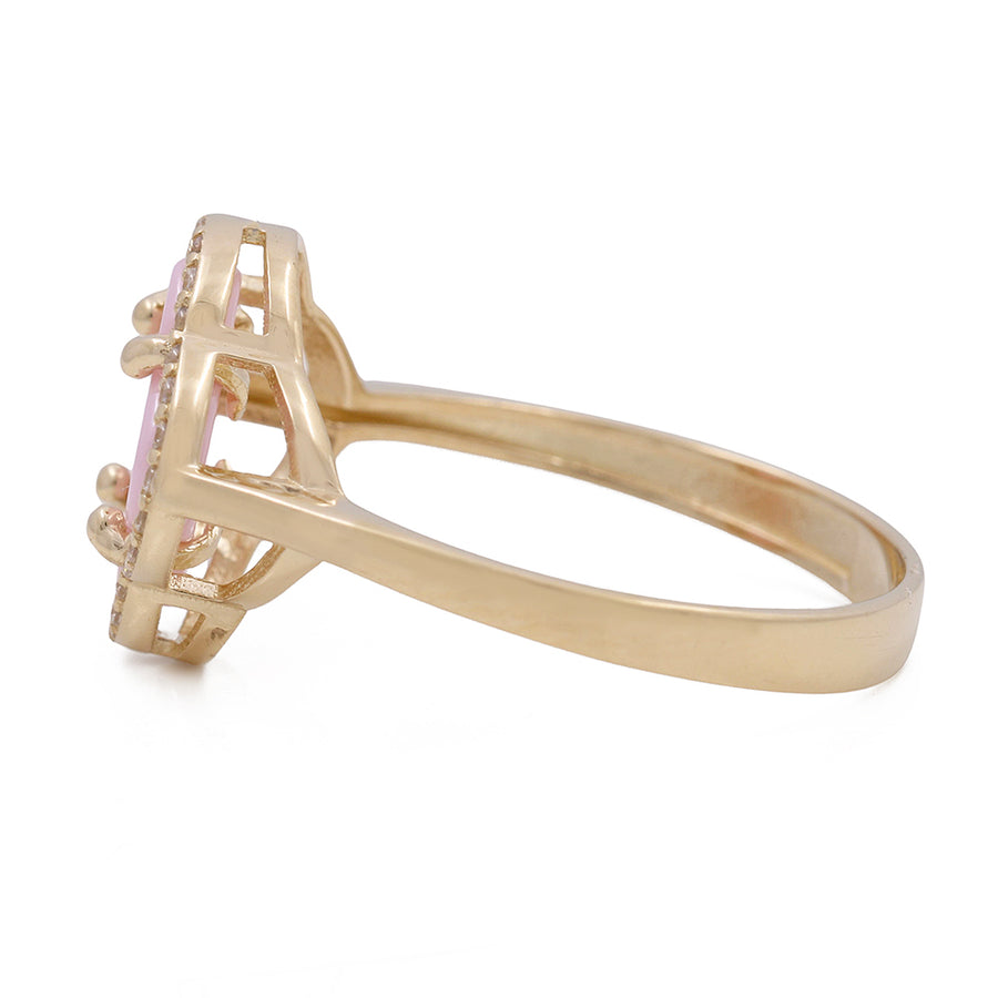 A Miral Jewelry 14K Yellow Gold Fashion Ring with Pink Color Stone and Cubic Zirconias.