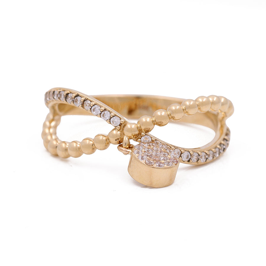 An Miral Jewelry ring with 14K Yellow Gold, Pink Stone Bead and Cubic Zirconias.