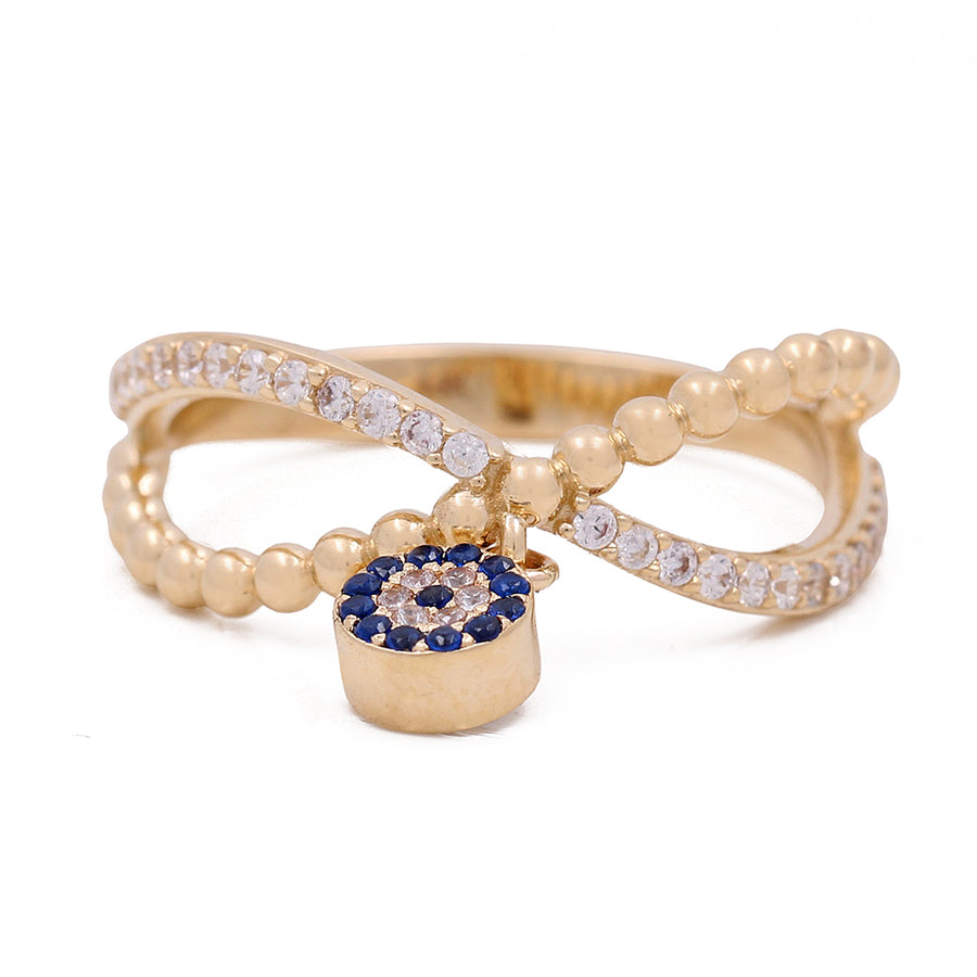 A Miral Jewelry 14K yellow gold ring with a blue sapphire stone bead and an evil eye.