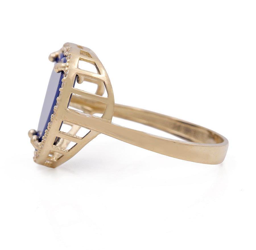 A Miral Jewelry 14K Yellow Gold Fashion Ring with Blue Heart Center Stone and Cubic Zirconias, perfect for fashion lovers.