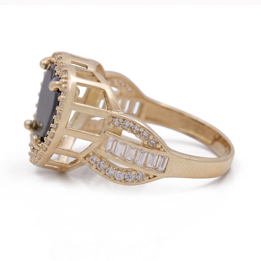 A Miral Jewelry 14K Yellow Gold Fashion Ring with Onyx Heart Center Stone and Cubic Zirconias.