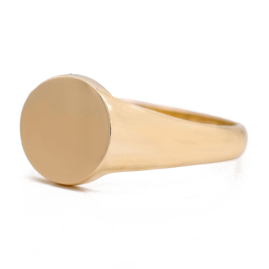 A timeless Miral Jewelry 14K yellow gold signet ring on a white background.