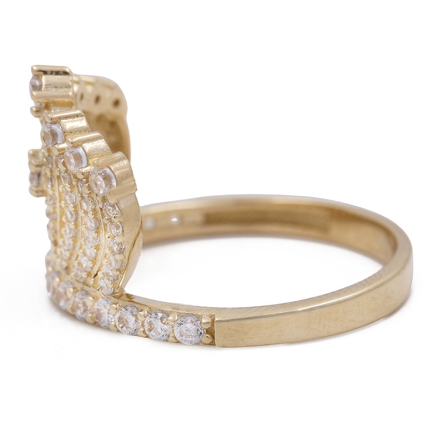 A 14K yellow gold Miral Jewelry ring with diamonds in the center, perfect for adding a touch of elegance and luxury to any outfit.