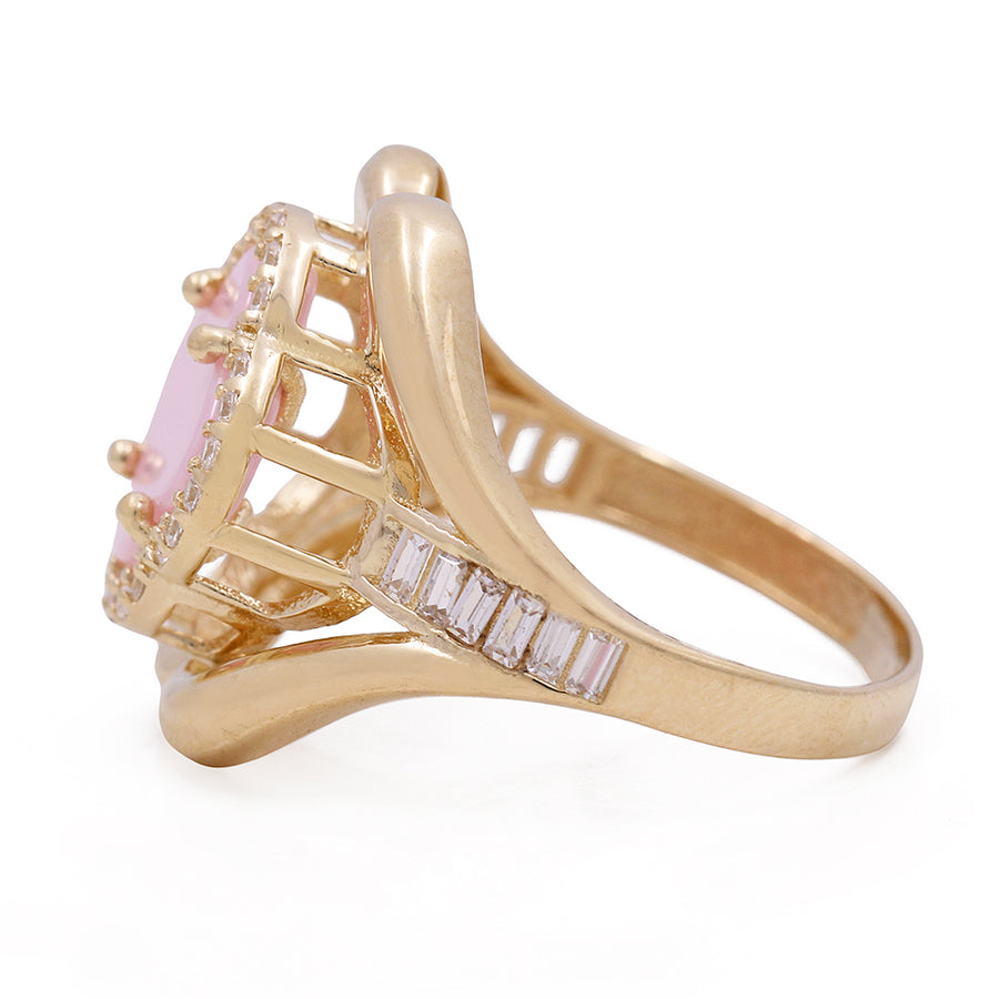 An oval pink sapphire and diamond fashion ring in yellow gold. -> A Miral Jewelry 14K Yellow Gold Fashion Ring with Pink Flower Center Stone and Cubic Zirconias.