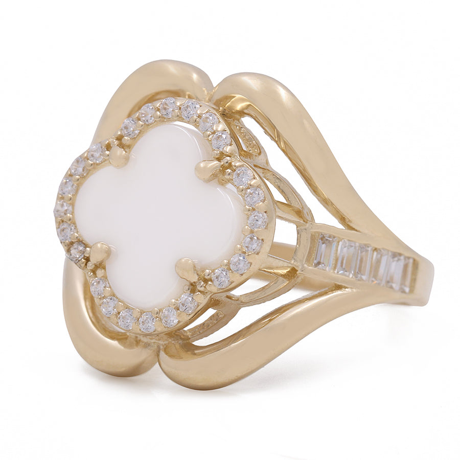 A white opal and diamond ring in yellow gold with mother of pearl has been replaced by a 14K Yellow Gold Fashion Ring with Mother of Pearl Flower Center Stone and Cubic Zirconias from Miral Jewelry.
