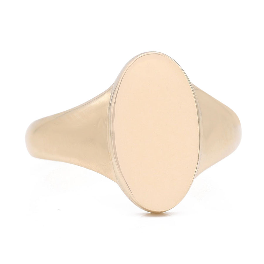 A timeless Oval Signet Ring, crafted in Miral Jewelry's 14K Yellow Gold Fashion Flat Oval Ring, exuding fashion and sophistication.