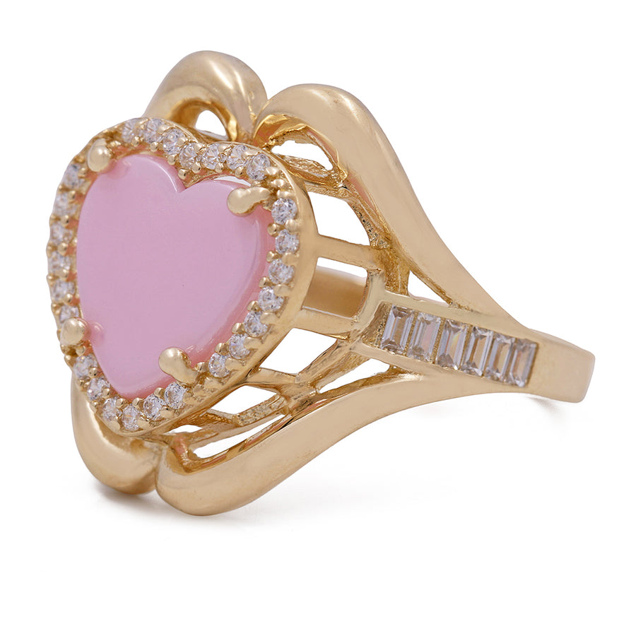 A pink heart-shaped Miral Jewelry fashion ring crafted in 14K yellow gold, adorned with sparkling diamonds.