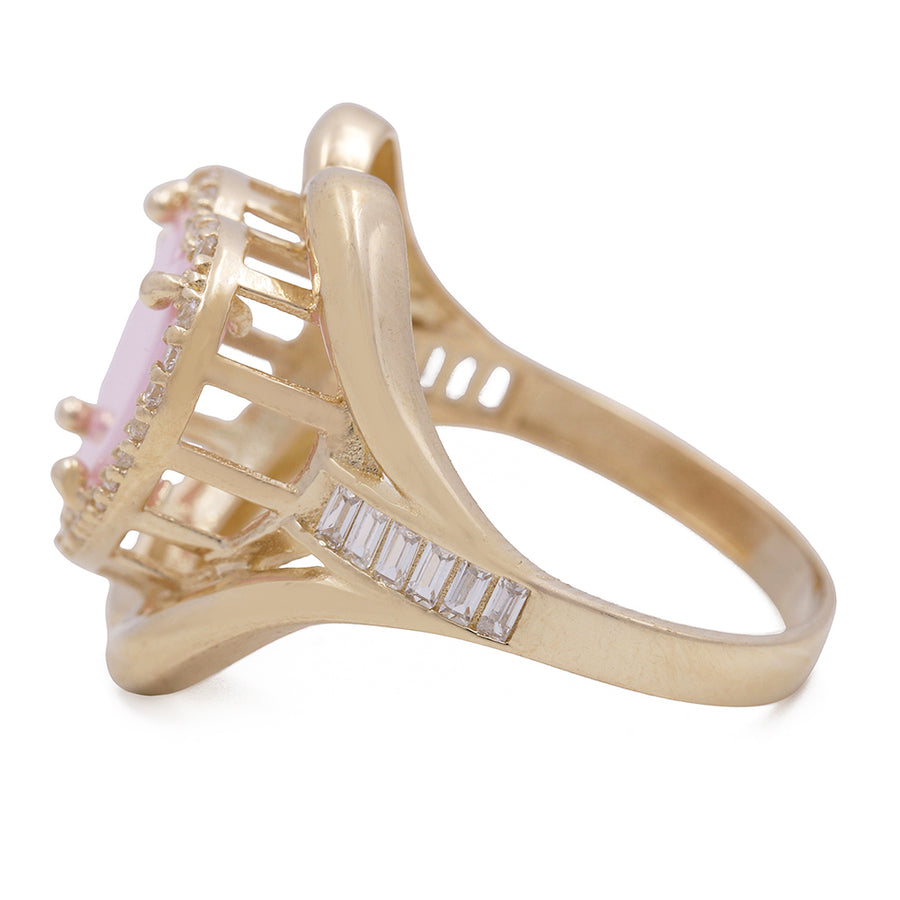 A Miral Jewelry 14K Yellow Gold Fashion Ring with Pink Heart Center Stone and Cubic Zirconias.