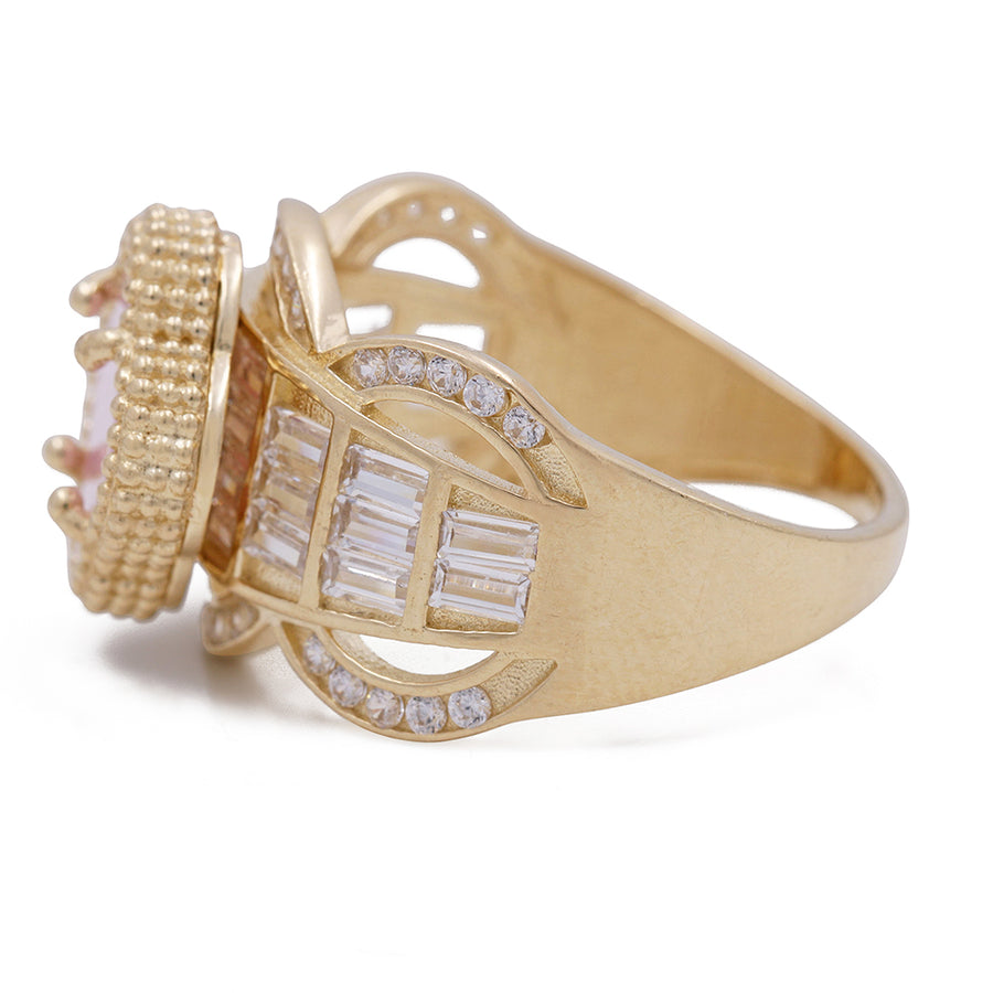 A Miral Jewelry 14K Yellow Gold Fashion Ring adorned with a captivating Pink Color Stone and accented with sparkling Cubic Zirconias.