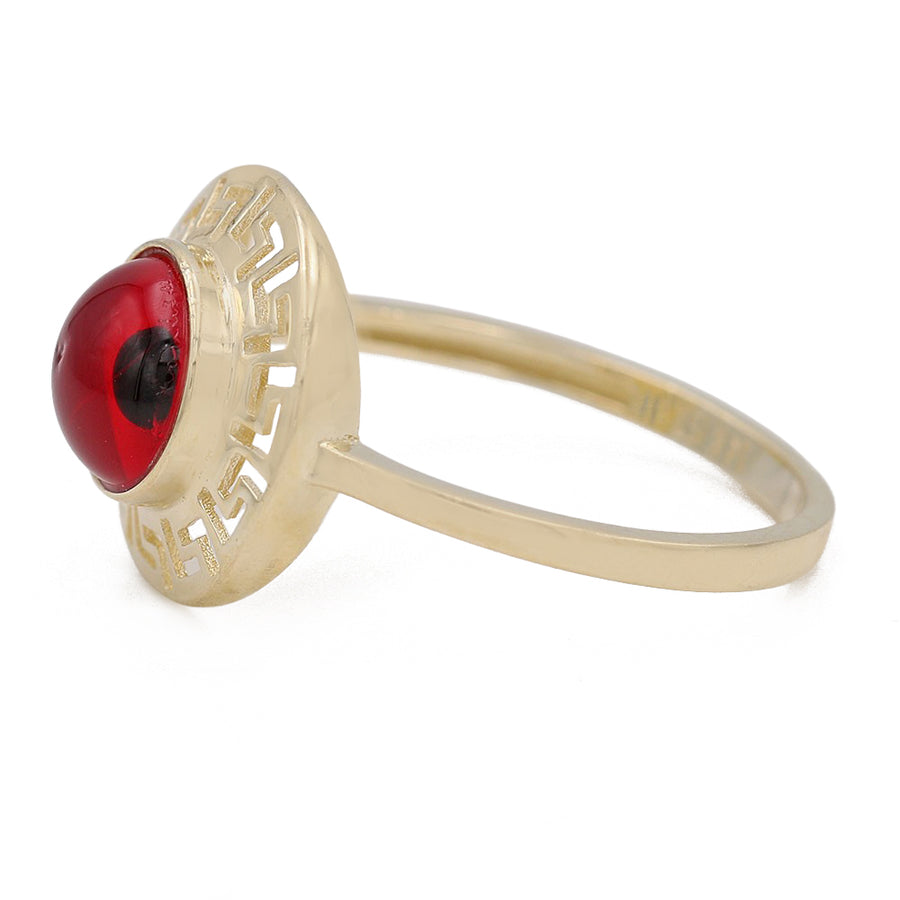 A Miral Jewelry fashion-forward 14K Yellow Gold Fashion Red Evil Eye Ring with a mesmerizing red eye in the center.