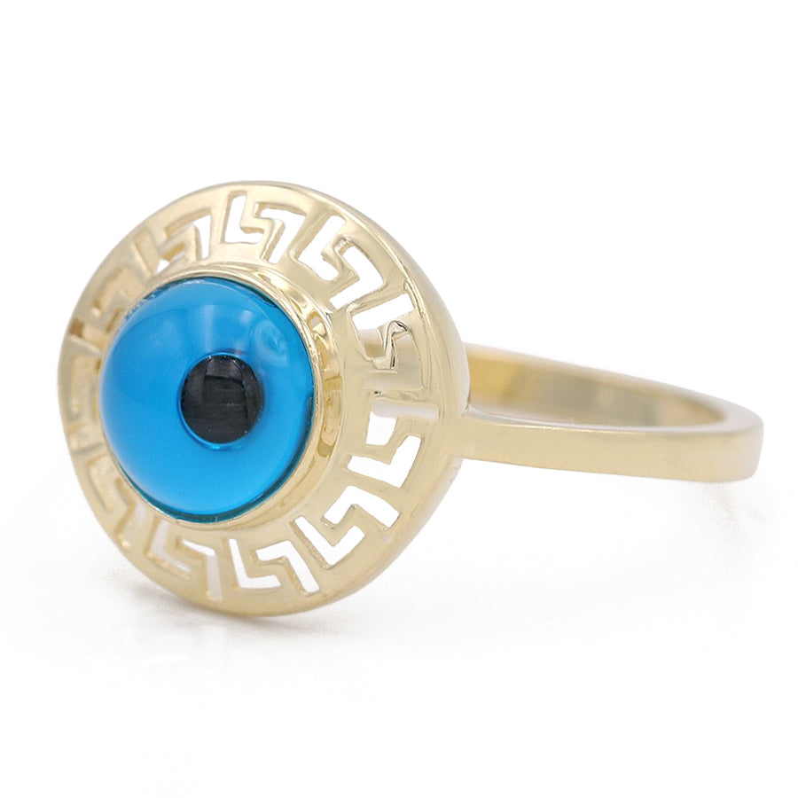 A Miral Jewelry 14K Yellow Gold Fashion Blue Evil Eye Ring with a blue evil eye on it.