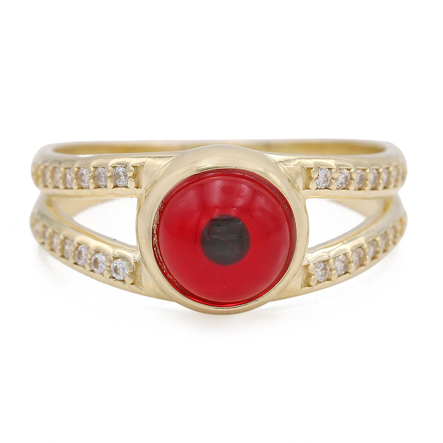 A 14K Yellow Gold Fashion Red Evil Eye Ring with Cubic Zirconia by Miral Jewelry, accentuated by diamonds.