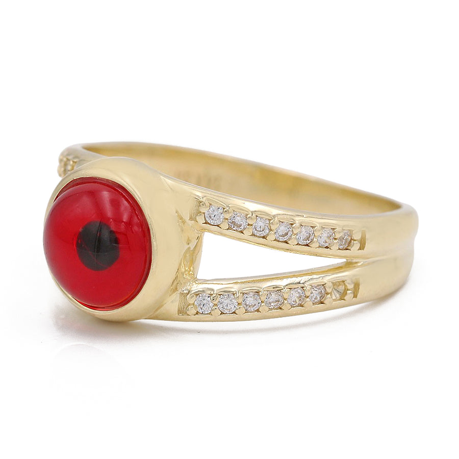 A Miral Jewelry 14K Yellow Gold Fashion Red Evil Eye Ring with Cubic Zirconia, adorned with diamonds for a touch of elegance.
