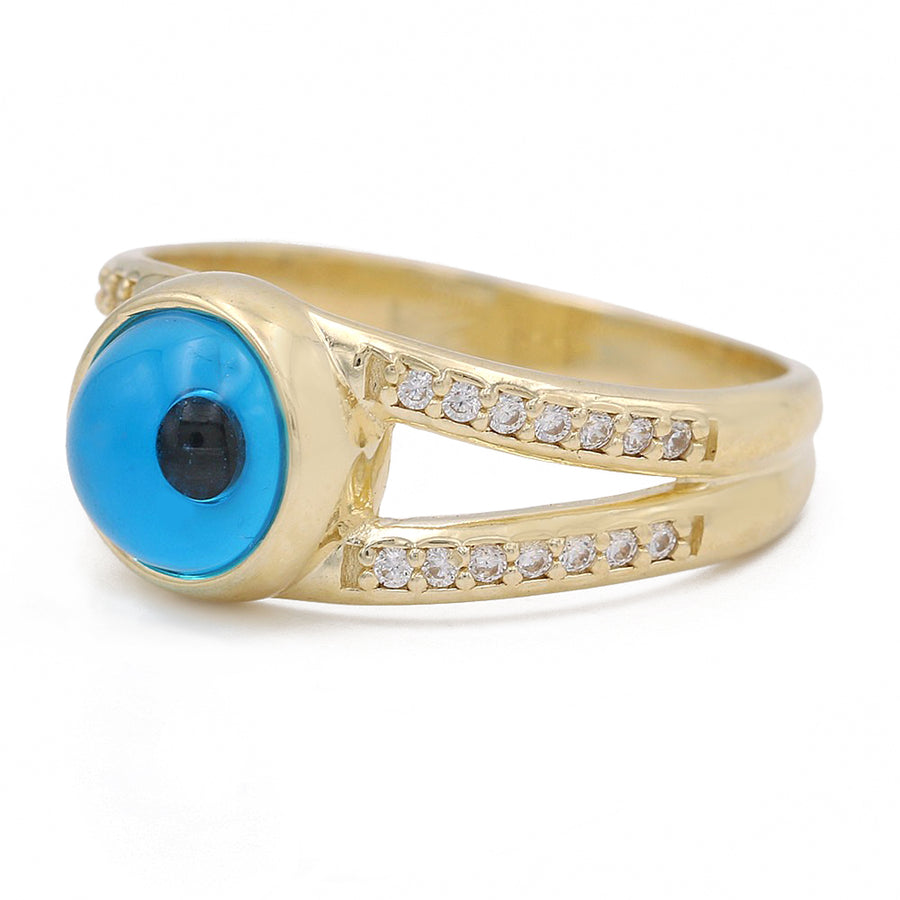 A trendy fashion statement - a Miral Jewelry 14K Yellow Gold Fashion Blue Evil Eye Ring with Cubic Zirconias adorned with dazzling diamonds.